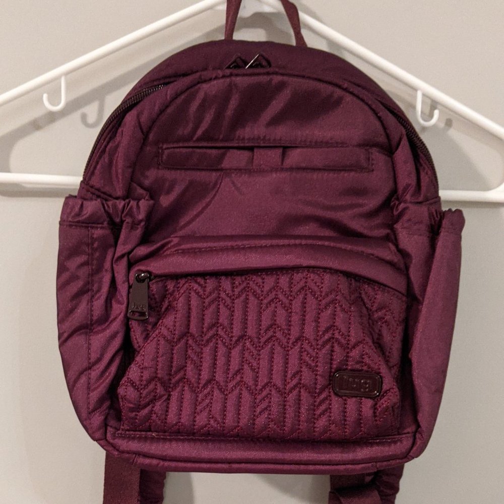 Lug Mini Orbit backpack, wine colored, tags on